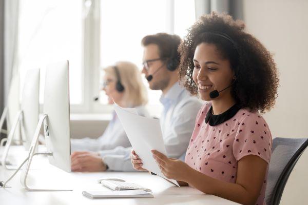 person in a call center smiling